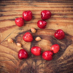 Ripe organic homegrown cherries on wooden background