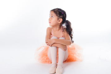 A little ballerina in the studio. On White Background