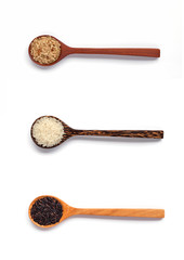 Wooden spoon and rice on white background