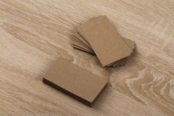 Kraft business cards on a wooden background