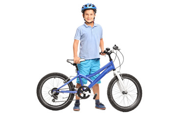 Obraz premium Little boy posing with his bicycle