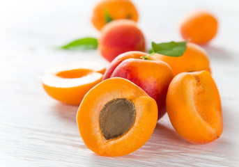 Fresh apricots on wooden table, close-up.