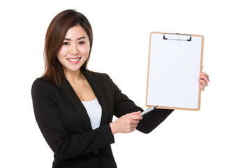 Young businesswoman show with blank page of clipboard