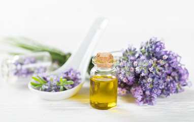 Fototapeta na wymiar Wellness treatments with lavender flowers on wooden table. Spa still-life.