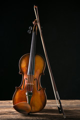 Fototapeta premium Old violin on dark background.