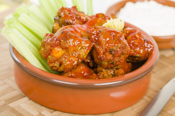 Buffalo Wings - Hot and spicy buffalo chicken wings with celery and cheese dip.

