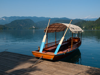 Naklejka na ściany i meble Traditional wooden boats on Bled lake