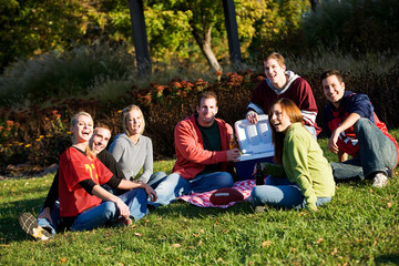 Fototapeta premium Football: Friends Relaxing After Playing in Park