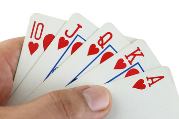 royal flush playing cards in hand.