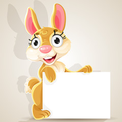 Obraz premium Cute baby bunny with a blank banner