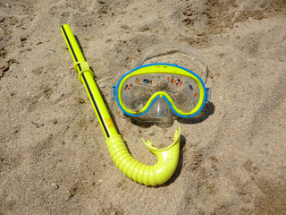 snorkel and scuba mask on the beach