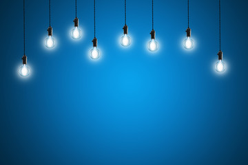 Idea concept - Vintage incandescent bulbs on blue background