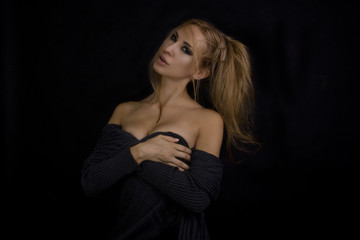 Naklejka premium Beautiful Sexy Blond Woman. Dark Background. Smokey Eyes Makeup