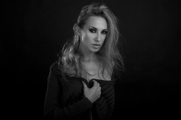 Naklejka premium Beautiful Sexy Blond Woman. Dark Background. Smokey Eyes Makeup