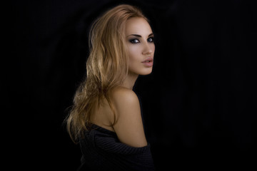 Naklejka premium Beautiful Sexy Blond Woman. Dark Background. Smokey Eyes Makeup