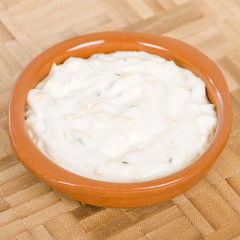 Cheese & Chive Sauce - Dipping sauce with cream, cheese and chives in a terracotta bowl.
