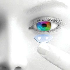 A woman puts a contact lenses. 3d render. Face is greyscale. The iris and the lens are colored.