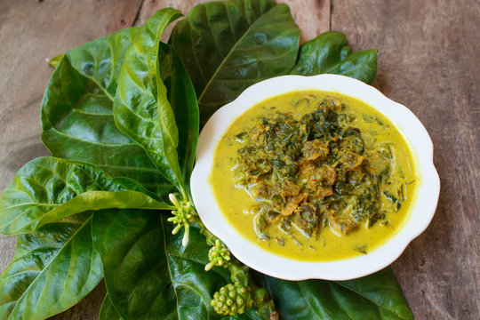 Cockle curry with noni leaves.