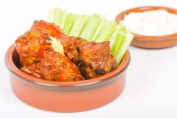 Buffalo Wings - Hot and spicy buffalo chicken wings with celery and cheese dip.
