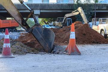 close up of loader bucket working at construction site.