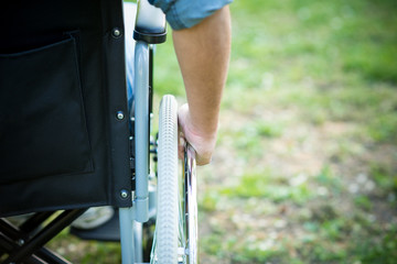 Detail of a man using a wheelchair