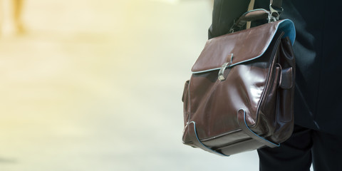 Businessman with an elegant brown leather bag