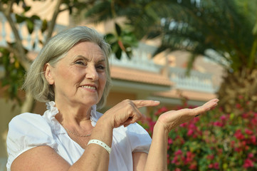 Older woman pointing