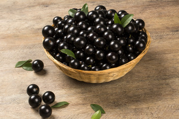 Berry Jaboticaba in bowl on wooden table