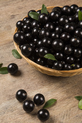 Berry Jaboticaba in bowl on wooden table