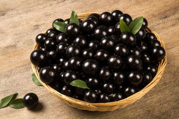 Berry Jaboticaba in bowl on wooden table