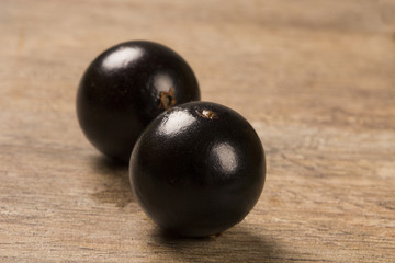 Berry Jaboticaba in bowl on wooden table