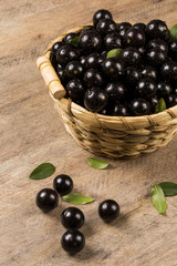 Berry Jaboticaba in bowl on wooden table