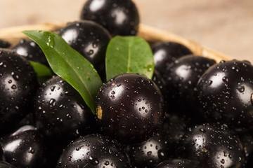 Berry Jaboticaba in bowl on wooden table