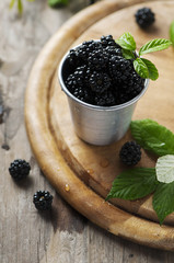 Sweet fresh blackberry on the wooden table