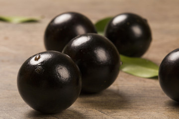 Berry Jaboticaba in bowl on wooden table