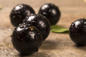 Berry Jaboticaba in bowl on wooden table