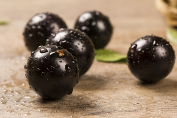 Berry Jaboticaba in bowl on wooden table