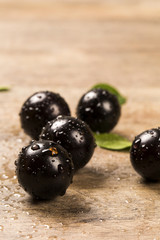 Berry Jaboticaba in bowl on wooden table