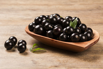 Berry Jaboticaba in bowl on wooden table