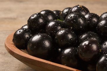 Berry Jaboticaba in bowl on wooden table