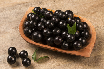 Berry Jaboticaba in bowl on wooden table