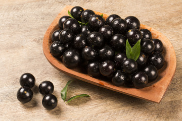 Berry Jaboticaba in bowl on wooden table
