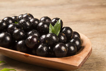 Berry Jaboticaba in bowl on wooden table