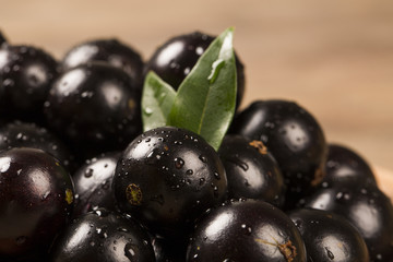 Berry Jaboticaba in bowl on wooden table