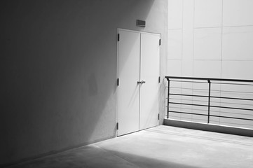 Concrete wall and door  with light from corner in Shopping mall at Siam Square ,Bangkok Thailand