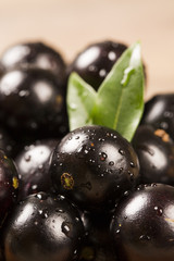 Berry Jaboticaba in bowl on wooden table