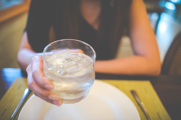 girl holding water glass