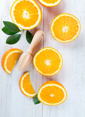 cut oranges on wooden surfce