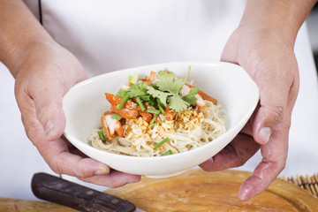 Chef present egg Noodle with roast chicken