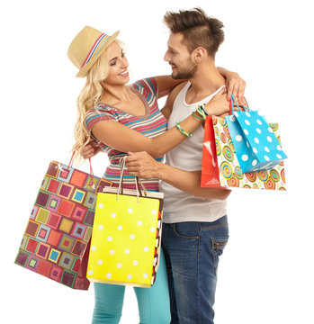 Couple with shopping bags. Studio shoot